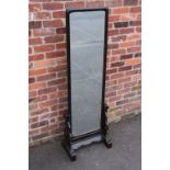 A CONTEMPORARY EBONISED CHEVAL MIRROR IN THE CHINESE STYLE, the rectangular double sided mirror