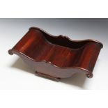 A MAHOGANY CHEESE COASTER, W 39.5 cm