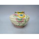 A CLARICE CLIFF WILKINSON POTTERY RHODANTHE PATTERN VASE OF SQUAT RIBBED FORM, decorated with a