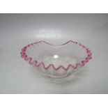 AN EARLY 20TH CENTURY STOURBRIDGE CLEAR AND OPALESCENT PINK FRILLED GLASS BOWL, with pontil mark