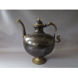 A LARGE VINTAGE EASTERN METAL DECORATIVE KETTLE / POURING VESSEL, with applied mask embellished