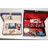 TWO JEWELLERY BOXES CONTAINING COSTUME JEWELLERY TO INCLUDE A CARVED CORAL NECKLACE, AGATE BEAD