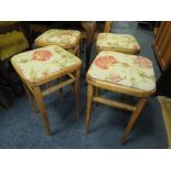 A SET OF FOUR RETRO KITCHEN STOOLS