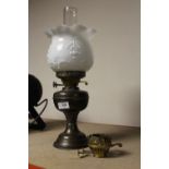 A VINTAGE BRASS OIL LAMP WITH FLORAL OPAQUE GLASS SHADE, DUPLEX BURNERS