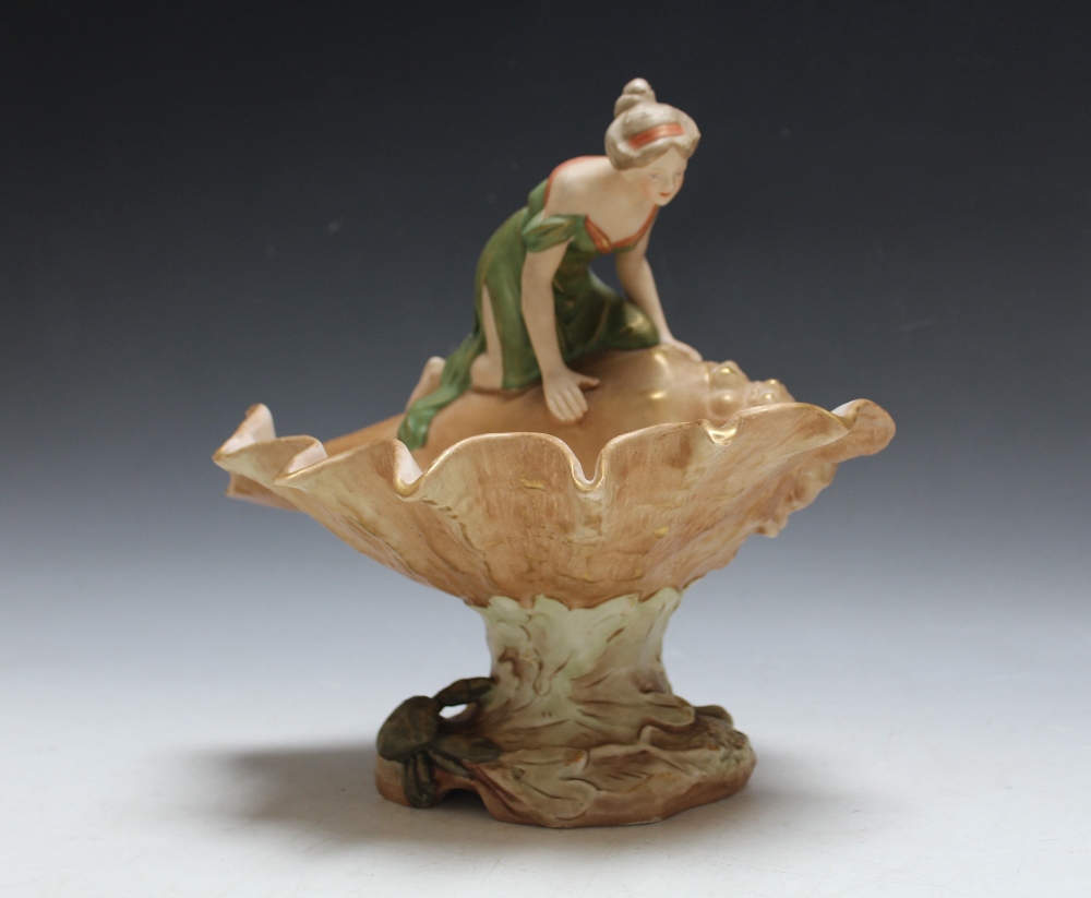 A LARGE ROYAL DUX FIGURE OF A LADY ON A CONCH SHELL, pink triangle mark to base, W 26 cm