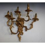 A LATE 19TH / EARLY 20TH GILT METAL FIVE BRANCH WALL APPLIQUE IN THE ROCOCO STYLE, wired for