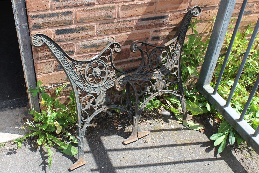 A PAIR OF CAST BENCH ENDS