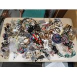 A BOX OF ASSORTED COSTUME JEWELLERY