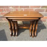 AN ERCOL NEST OF THREE TABLES H-42 W-57 CM (LARGEST)