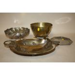 AN EASTERN WHITE METAL TRI-FOOTED BOWL TOGETHER WITH AN ARTS AND CRAFTS BRASS BOWL ON FEET, A