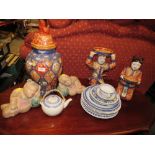 TWO MODERN CHINESE/ ORIENTAL HAND PAINTED FIGURES HOLDING BOWLS WITH ORANGE BACK STAMPS TALLEST
