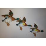 A SET OF THREE BESWICK FLYING MALLARD WALL PLAQUES