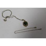A 9CT GOLD PENDANT SET WITH A LARGE PERIDOT STYLE GREEN STONE ON RG CHAIN, TOGETHER WITH A 9CT