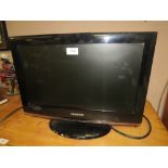 A SMALL SAMSUNG FLATSCREEN TV - WITH REMOTE