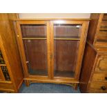 A VINTAGE OAK GLAZED BOOKCASE H-141 W-121 CM