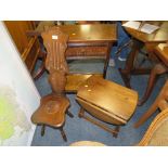 A CARVED OAK CREDENCE TYPE TABLE, SPINNING CHAIR AND A DROPLEAF TABLE (3)