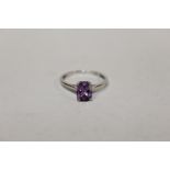 A STERLING SILVER AND AMETHYST DRESS RING, RING SIZE N