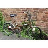 A RETRO RALEIGH BICYCLE WITH BASKET