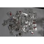 A LARGE QUANTITY OF PACKAGED SILVER CHARMS (50)