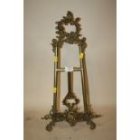 A 20TH CENTURY ROCOCO STYLE BRASS TABLE TOP PICTURE EASEL, H. 56 CM, W. 27 CM