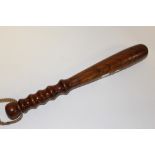 A VINTAGE TURNED WOODEN TRUNCHEON