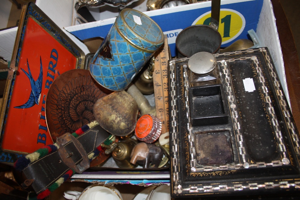 A BOX OF COLLECTABLES TO INCLUDE A MOTHER OF PEARL INLAID EBONISED DESK STAND, COW BELL ETC.