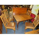 AN EARLY 20TH CENTURY MAHOGANY WIND-OUT DINING TABLE WITH ONE SPARE LEAF - WINDER - WITH FOUR