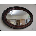 A VINTAGE OVAL WALL MIRROR W-82 CM WITH A NEST OF TABLES