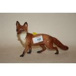 A BESWICK STANDING FOX FIGURE