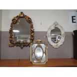 A CONTEMPORARY GILT ARCHED WALL MIRROR H-68 W-48 CM TOGETHER WITH TWO MORE DECORATIVE MIRRORS (3)