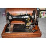 A VINTAGE CASED SINGER SEWING MACHINE