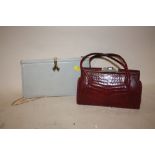 A VINTAGE RED CROCODILE SKIN EFFECT HANDBAG, TOGETHER WITH A GREY LEATHER EVENING BAG