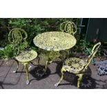 A METAL GARDEN TABLE AND THREE CHAIRS