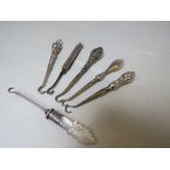 A COLLECTION OF SILVER MINIATURE BUTTON HOOKS, various makers and hallmarks, comprising silver