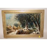 A GILT FRAMED OIL ON BOARD DEPICTING A RURAL WOODED VILLAGE SCENE WITH FIGURE CROSSING A BRIDGE