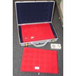AN EMPTY HARD CASE WITH EMPTY COIN COLLECTOR TRAYS
