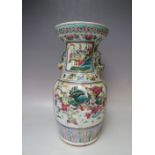 AN ANTIQUE ORIENTAL PORCELAIN BALUSTER VASE, with twin fish handles, floral decoration throughout