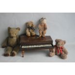 A CHILD'S TOY PIANO TOGETHER WITH A VINTAGE TEDDY BEAR, a Russ teddy bear, a Leosco meerkat and a