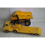 A VINTAGE TONKA YELLOW ARTICULATED LORRY AND TRAILER, together with a vintage Tonka XMB975 yellow