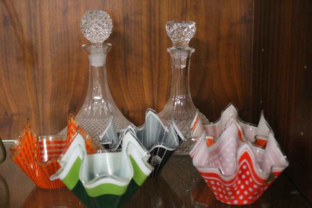 TWO GLASS DECANTERS AND FIVE GLASS HANDKERCHIEF VASES