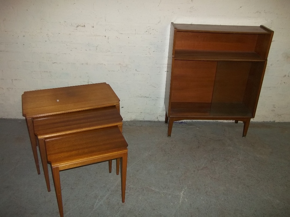 A SAPELE / MAHOGANY DISPLAY BOOKCASE WITH SLIDING GLASS DOORS AND A NEST OF TABLES