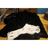 A FUR COAT SIZE 16 TOGETHER WITH A MATCHING FUR HAT AND A WHITE FUR COLLAR