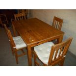 A PINE DINING SET WITH FOUR CHAIRS