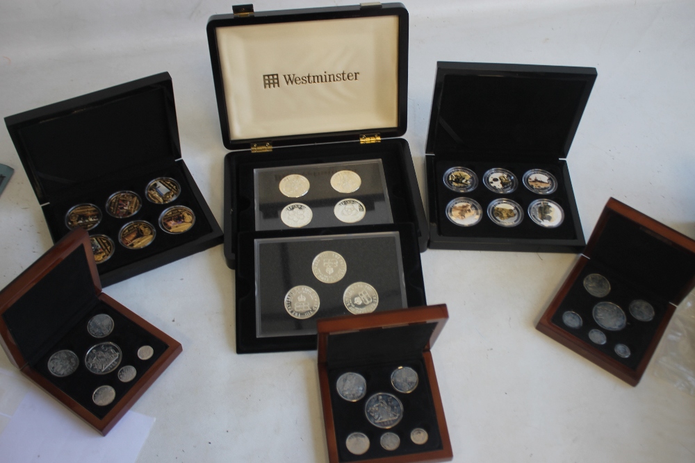 A COLLECTION OF BOXED COMMEMORATIVE COINS, to include three Edward VIII retro sets, a set of St