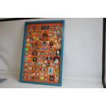 A FRAMED COLLECTION OF CIRCA 130 ELVIS PRESLEY PIN AND CLOTH BADGES, 96 cm x 66 cm