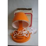 A VINTAGE RETRO ORANGE CASQUE-VALISE CALORBOXED PORTABLE HAIRDRYER, in box with instruction book