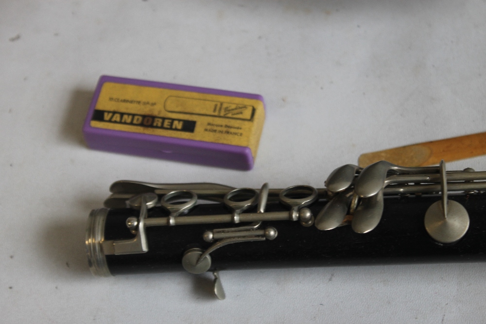 A CASED F. BUISSON B FLAT CLARINET, with cleaner and spare reeds, plate on case reads "John E. - Image 4 of 5