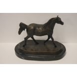 A BRONZE STYLE HORSE ON PLINTH