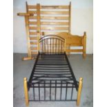 A KING SIZE BED FRAME (BOLTS MISSING) AND A SINGLE METAL FRAME BED