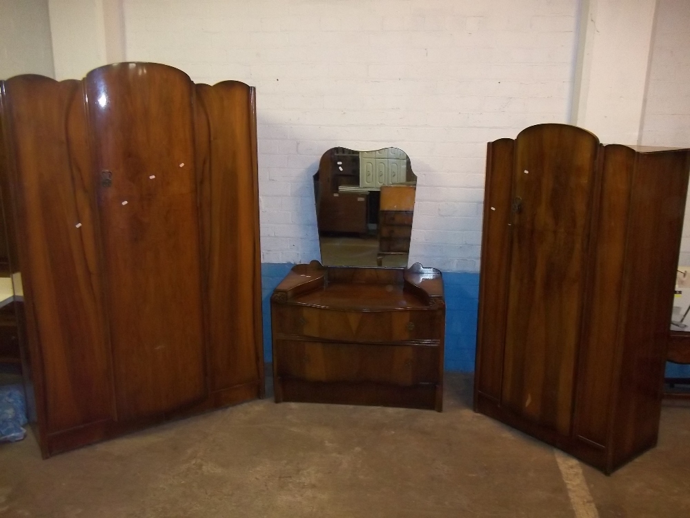 A MID CENTURY BOW FRONTED THREE PIECE BEDROOM SUITE WITH WARDROBES AND DRESSING TABLE